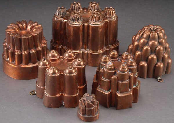 6 ENGLISH COPPER FOOD MOLDS, 19TH/EARLY 20TH C: SIX ENGLISH COPPER FOOD MOLDS, 19TH/EARLY 20TH CENTURY. Of various turret shape and size. Largest height 5.5 inches (14 cm).
