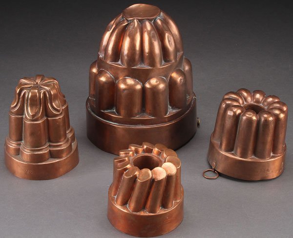 4 ENGLISH COPPER FOOD MOLDS, 19TH CENTURY: FOUR ENGLISH COPPER FOOD MOLDS, 19TH CENTURY. Comprising two turret molds and two tube molds. Largest height 8.25 inches (21 cm).