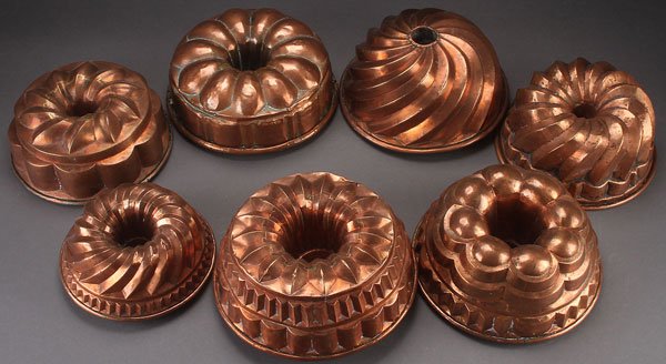 7 ENGLISH COPPER RING AND TUBE FOOD MOLDS 19TH C: A GROUP OF SEVEN ENGLISH COPPER RING AND TUBE FOOD MOLDS, 19TH CENTURY. Of various size and patterns. All apparently unmarked. Largest diameter 10.75 inches (27.5 cm).