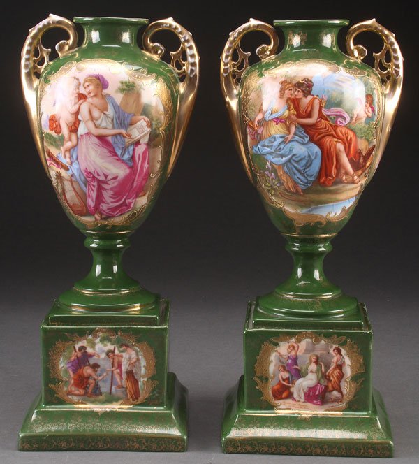 PAIR SEVRES STYLE PORCELAIN PORTRAIT SCENE URNS: A PAIR OF SEVRES STYLE PORCELAIN PORTRAIT SCENE URNS, CIRCA 1900. Each with romantic transfer scenes after Kaufman on a green ground with gilt decoration. Height 14.5 inches (36.5 cm).