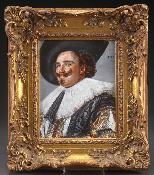 A FRAMED PORCELAIN PLAQUE OF A CAVALIER: A FRAMED PORCELAIN PLAQUE OF A CAVALIER, 2ND HALF 20TH CENTURY. After Frans Hals, contained in an ornate period style gilt frame with embossed scrolled decoration. The plaque 9.75 inches x 7.25 inches
