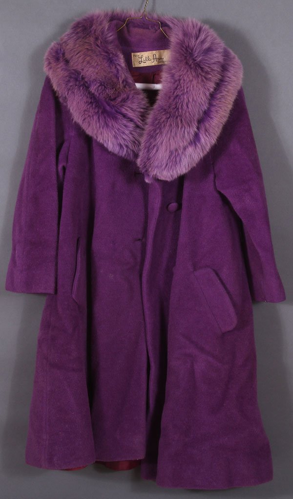 A GROUP OF FOUR LILLI ANN DESIGNER WOMEN'S COATS,: A GROUP OF FOUR LILLI ANN DESIGNER WOMEN'S COATS, MID 20TH CENTURY. Comprising a purple wool with dyed animal fur collar, a white leather and faux seal skin coat, a black faux seal skin coat, and a th