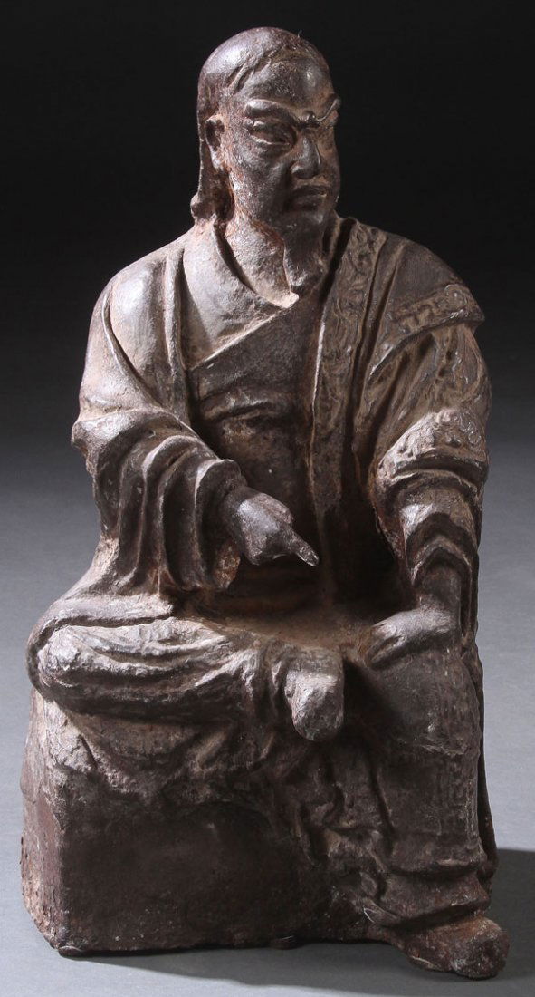CHINESE CAST IRON FIGURE OF AN IMMORTAL, QING DYNASTY: A CHINESE CAST IRON FIGURE OF AN IMMORTAL, QING DYNASTY. Depicted in seated form with flowing robes. Height 20.5 inches (52 cm).