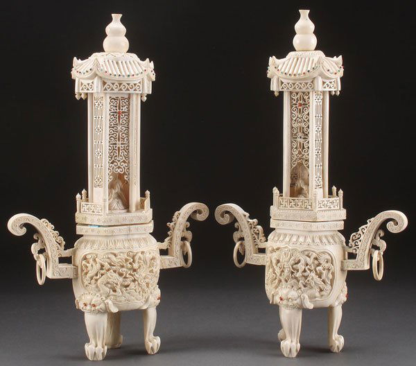PAIR CHINESE EXPORT CARVED IVORY CENSERS, LATE 19TH C: A LARGE PAIR OF CHINESE EXPORT CARVED IVORY CENSERS, LATE QING DYNASTY. The two handled bases with dragon carved medallions raised on three claw foot legs with mask head terminals, surmounted with a r