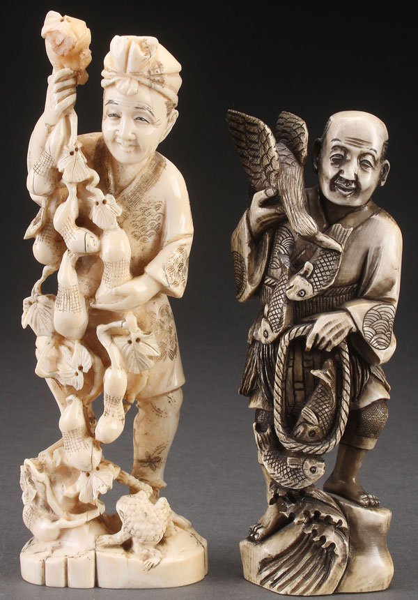 A PAIR OF JAPANESE CARVED IVORY OKIMONOS: A PAIR OF JAPANESE CARVED IVORY OKIMONOS, PROBABLY MEIJI PERIOD. Depicting a man with double gourds and toad, and a man with fish. Largest height 7 inches (17.8 cm).
