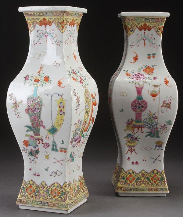CHINESE FAMILLE ROSE SQUARE BALUSTER VASES: A PAIR OF CHINESE FAMILLE ROSE SQUARE BALUSTER PORCELAIN VASES. With Buddhist symbols. Height 16.75 inches (42.5 cm).
