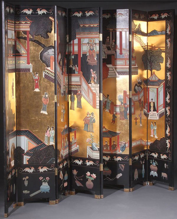 A LARGE CHINESE FOLDING COROMANDEL SCREEN: A LARGE AND IMPRESSIVE CHINESE FOLDING COROMANDEL SCREEN, 20TH CENTURY. Eight panels with intaglio carved and polychrome scenes, depicting an imperial courtyard with multiple figures and pagodas on a