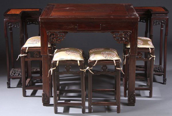 A FINE CHINESE MAHJONG TABLE, 20TH CENTURY.: A FINE CHINESE MAHJONG TABLE, 20TH CENTURY. Of square form in rosewood, with foliate carved brackets and squared legs with scroll carved terminals, including four matching benches, and with two associ