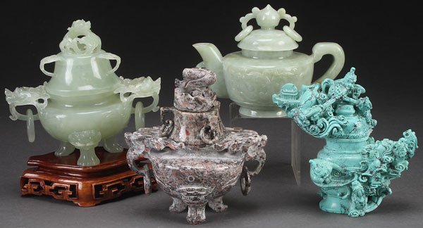 3 CHINESE CARVED HARDSTONE LIDDED CENSERS: THREE CHINESE CARVED HARDSTONE LIDDED CENSERS, 20TH CENTURY. Comprising a celadon colored soapstone tripod censer with dragon head and loose ring handles, a fossiliferous censer with dragon head handl