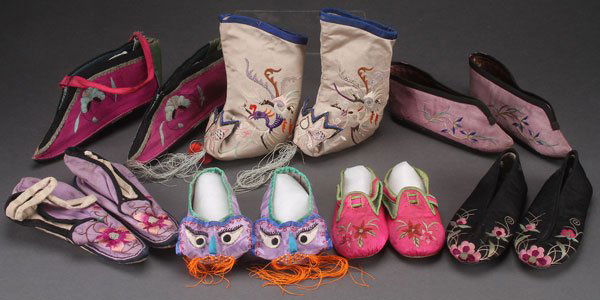 SEVEN PAIRS OF ORIENTAL EMBROIDERED SILK SHOES: SEVEN PAIRS OF ORIENTAL EMBROIDERED SILK SHOES AND BOOTS, EARLY 20TH CENTURY. Including bound feet style and animal mask festival style, mostly for children. Largest height 6 inches (15 cm).