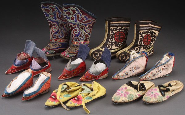 EIGHT PAIRS OF ORIENTAL EMBROIDERED SILK SHOES: EIGHT PAIRS OF ORIENTAL EMBROIDERED SILK SHOES AND BOOTS, EARLY 20TH CENTURY. Including bound feet style, mostly children's, of various size. Largest height 9 inches (23 cm).