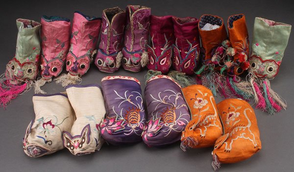 8 PAIRS OF ORIENTAL EMBROIDERED SILK FESTIVAL SHOES: EIGHT PAIRS OF ORIENTAL EMBROIDERED SILK FESTIVAL BOOTS, EARLY 20TH CENTURY. With various animal masks and decoration. Largest height 6 inches (15 cm).