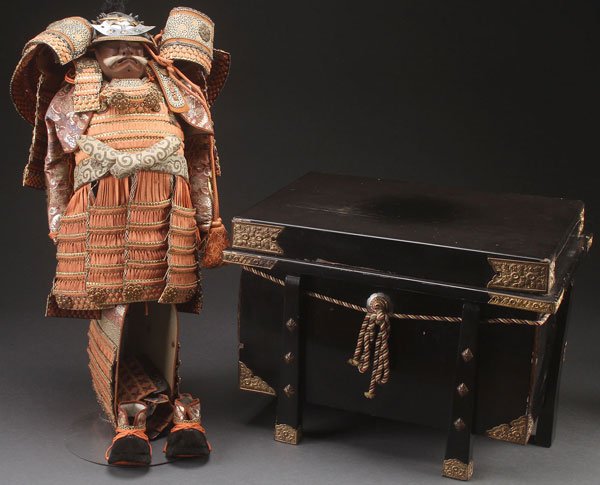 A JAPANESE MODEL OF SAMURAI ARMOR: A JAPANESE MODEL OF SAMURAI ARMOR, FIRST HALF 20TH CENTURY. Silk, embossed gilt metal, and leather. Height approximately 22 inches (56 cm) and contained in a black lacquer box with gilt embossed metal