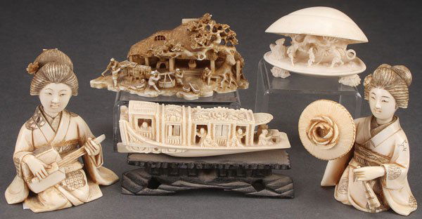 FIVE JAPANESE CARVED IVORY OKIMONOS, MEIJI PERIOD: FIVE JAPANESE CARVED IVORY OKIMONOS, MEIJI PERIOD. Comprising a pair of geishas, a scenic pavilion with workers, an interior scenic open clamshell, and a river boat on wooden stand. Largest length 3.5