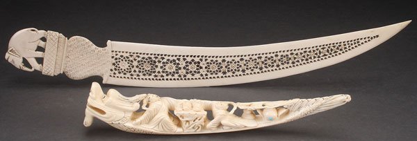A LARGE CHINESE EXPORT CARVED IVORY PAPER KNIFE,: A LARGE CHINESE EXPORT CARVED IVORY PAPER KNIFE, PROBABLY LATE QING PERIOD. With elephant figural handle and floral medallion pierced blade. Together with a carved ivory dragon and figural ornament wi