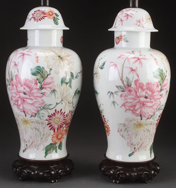 PAUL HANSON CHINOISSERIE DECORATED PORCELAIN LAMPS: A PAIR OF PAUL HANSON CHINOISSERIE DECORATED PORCELAIN URN/LAMPS, 20TH CENTURY. Height to sockets 19 inches (48.5 cm).