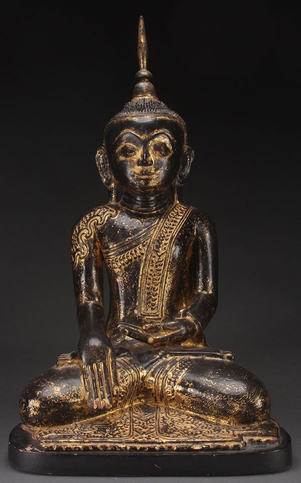 A PAIR OF TIBETAN BUDDHAS: A PAIR OF TIBETAN BUDDHAS, 19TH/20TH CENTURY. Comprising a large Tibetan papier-mâché Buddha depicted in seated form with an ebonized and parcel gilt finish, raised on a later conforming wood base. 