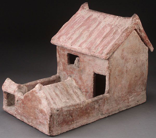 A CHINESE HAN STYLE ARCHITECTURAL FUNERARY MODEL.: A CHINESE HAN STYLE ARCHITECTURAL FUNERARY MODEL. In redware with earthen encrustation, modeled as a home with removable roof and courtyard. Height 15 inches (38 cm), length 20.25 inches (51.5 cm).