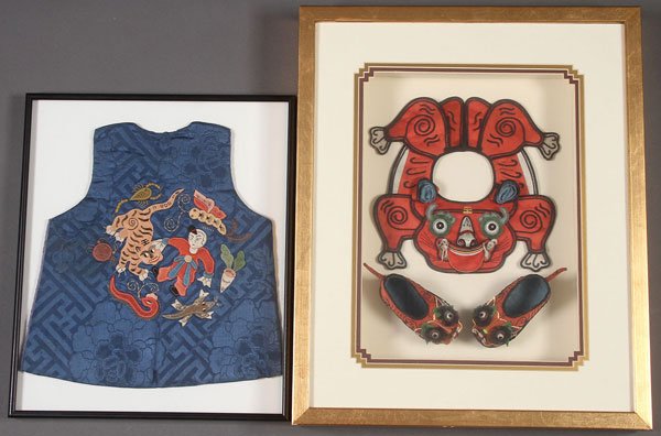 A FINE GROUP OF EMBROIDERED KOREAN CHILD TEXTILES: A FINE GROUP OF EMBROIDERED KOREAN CHILD TEXTILES, EARLY 20TH CENTURY. Comprising a silk jacket embroidered with a figure, tiger and other animal forms, and a shadow box framed beast form collar with 