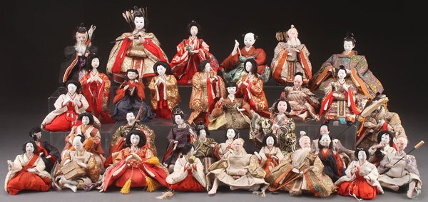 A LARGE COLLECTION OF JAPANESE NINGYO DOLLS, 20TH: A LARGE COLLECTION OF JAPANESE NINGYO DOLLS, 20TH CENTURY. Approximately 35, each with gofun faces and inset glass eyes, dressed in period style clothing. Largest height 7 inches (18 cm).