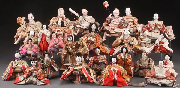 A LARGE COLLECTION OF JAPANESE NINGYO DOLLS: A LARGE COLLECTION OF JAPANESE NINGYO DOLLS, 20TH CENTURY. Approximately 36, each with gofun faces and inset glass eyes, dressed in period style clothing. Largest height 7 inches (18 cm).