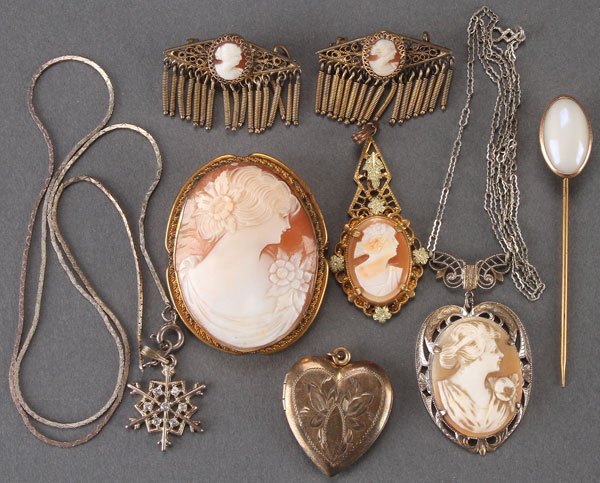 A LADIES VICTORIAN JEWELRY GROUP: A LADIES VICTORIAN JEWELRY GROUP. Comprising a large carved shell cameo brooch, a carved shell cameo pendant, a multi-toned gold filled cameo pendant, a pair of carved shell cameo shoe pins, an opalin