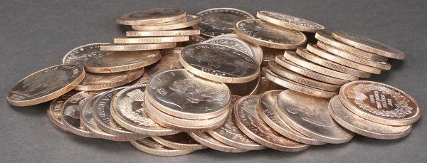 A GROUP OF 50 ONE OUNCE SILVER ROUNDS. With mixed: A GROUP OF 50 ONE OUNCE SILVER ROUNDS. With mixed designs after U.S. coins including Buffalo nickel, Morgan dollar, and Mercury dime. 50 Troy oz. total. Provenance:From a prominent Midwest estate and