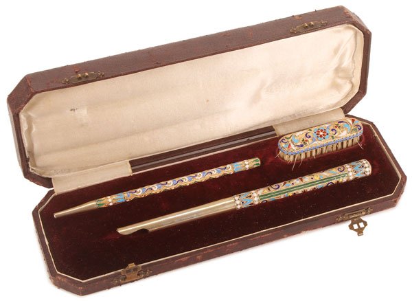 A RUSSIAN SILVER & ENAMELED CASED WRITING SET: A RUSSIAN SILVER-GILT AND CLOISONNÉ ENAMELED CASED WRITING SET, MOSCOW, 1899-1908. Comprising a silver-gilt and cloisonné enameled ink pen handle, a similarly decorated mechanical pencil and brush.