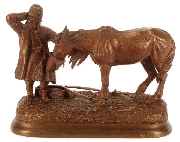 FINE RUSSIAN BRONZE BY EVGENY NAPS: EVGENY IVANOVICH NAPS(Russian 19th/20th century)A Man Feeding His Horse- circa 1879Bronze with dark brown patinaSigned on base in Cyrillic "Sculpted by E. Naps" and in Latin with Woerffel foundry mark