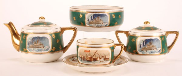 AN EARLY SOVIET PORCELAIN PARTIAL TEA SERVICE: AN EARLY SOVIET PORCELAIN PARTIAL TEA SERVICE COMMEMORATING THE RESCUE OF THE SWEDISH PILOT LUMBORG AND ITALIAN EXPLORER NOBILE, BARANOVSKY PORCELAIN FACTORY, CIRCA 1930. Comprising a lidded teapot an