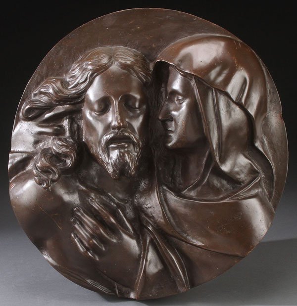 BRONZE TONDO PLAQUE OF THE PIETA: A LARGE PATINATED BRONZE TONDO RELIEF PLAQUE OF THE PIETA, PROBABLY FRENCH, 19TH CENTURY. Finely modeled in high relief, the Virgin cradles the body of her crucified son, apparently unmarked, verso wi