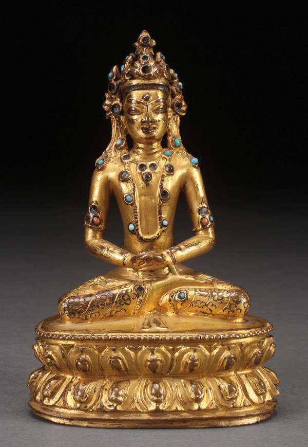 TIBETAN GILT BRONZE & JEWELED FIGURE OF AMITAYUS: A TIBETAN GILT BRONZE AND JEWELED FIGURE OF AMITAYUS, PROBABLY 18TH CENTURY, PERHAPS EARLIER. Depicting the finely tooled figure in seated position atop a double lotus throne, and inset with various j