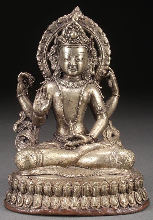 A TIBETAN SILVERED BRONZE FIGURE OF BUDDHA: A TIBETAN SILVERED BRONZE FIGURE OF BUDDHA, POSSIBLY 19TH CENTURY. Depicting the four-armed figure raised on a double lotus throne. Height 7.25 inches (18 cm).