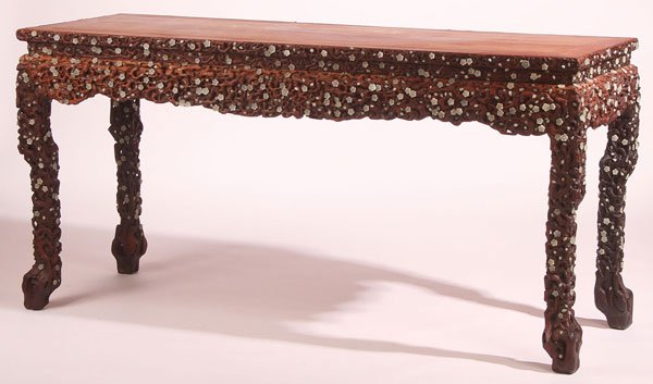 CHINESE CARVED WOOD & JADE MOUNTED ALTAR STAND: A CHINESE CARVED ROSEWOOD AND WHITE JADE MOUNTED ALTAR STAND. Of rectangular form with carved and pierced foliage in a densely packed pattern continuing with the four tall legs, mounted throughout wit