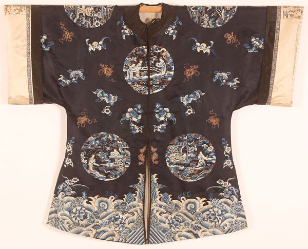 CHINESE EMBROIDERED SILK SEMI FORMAL ROBE: A CHINESE EMBROIDERED SILK SEMI FORMAL ROBE, 20TH CENTURY. With scenic medallions and Buddhist symbols on a dark blue ground. Width 50 inches (127 cm), length 40 inches (101.5 cm).