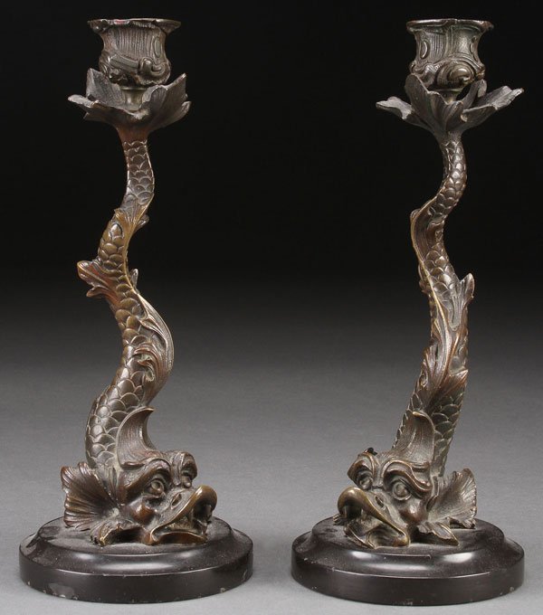 PAIR FRENCH NEOCLASSIC BRONZE CANDLE STANDS: A PAIR OF FRENCH NEOCLASSIC BRONZE AND SLATE MOUNTED CANDLE STANDS, 19TH CENTURY. Modeled as dolphins with the tails terminating in candle sockets. Height 10.25 inches (26 cm).