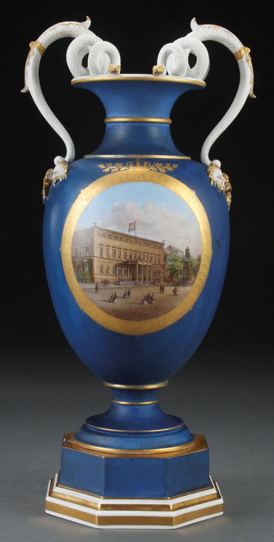 A VERY FINE KPM PORCELAIN HAND PAINTED SCENIC URN: A VERY FINE KPM PORCELAIN HAND PAINTED SCENIC URN, 19TH CENTURY. Painted with a medallion of a government building and courtyard within a tooled gilt frame terminating with laurels and a crown, reserv