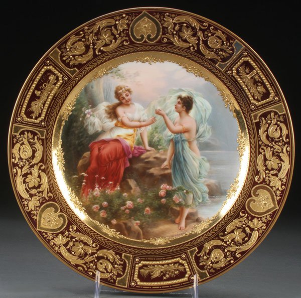 A VERY FINE ROYAL VIENNA PORTRAIT PLATE: A VERY FINE ROYAL VIENNA PORTRAIT PLATE OF TWO YOUNG BEAUTIES, LATE 19TH CENTURY. Signed Wagner, the cavetto well-painted with two figures in flowing gowns within an elaborate gilt and raised enamel b