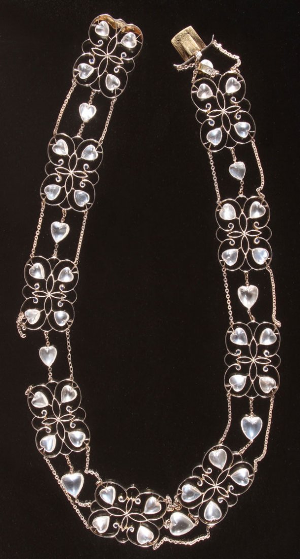 BELLE EPOQUE MOONSTONE, SAPPHIRE & GOLD NECKLACE: A VERY FINE BELLE EPOQUE MOONSTONE, SAPPHIRE AND GOLD NECKLACE, CIRCA 1900. Designed as a series of nine openwork gold plaques, centering upon a quatrefoil motif, extending heart shaped cabochon moons
