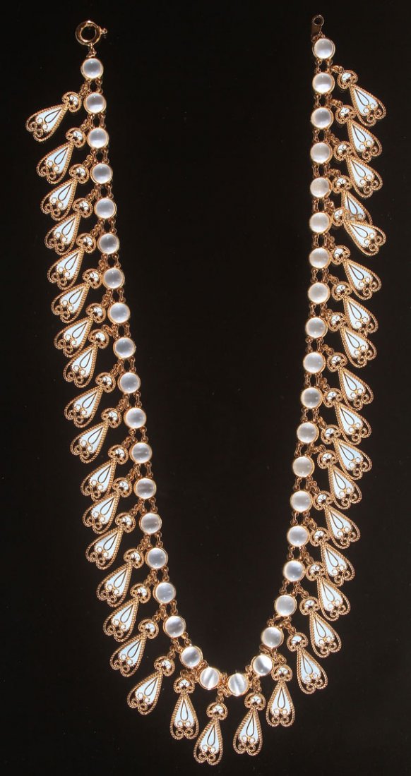 SOPHIA D. MOONSTONE AND PLIQUE-A-JOUR NECKLACE: A VERY FINE SOPHIA D. MOONSTONE AND PLIQUE-A-JOUR 18K GOLD NECKLACE, LAST QUARTER 20TH CENTURY. The 39 very fine cabochon moonstones bezel set and joined with gold links, each suspending a scalloped f