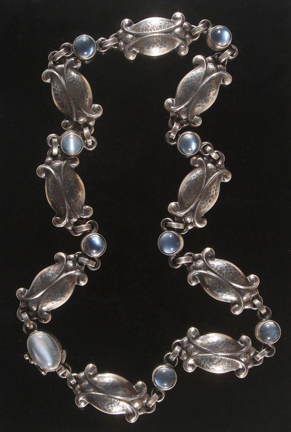 GEORG JENSEN STERLING SILVER & MOONSTONE NECKLACE: A GEORG JENSEN STERLING SILVER AND MOONSTONE NECKLACE, AFTER 1945. With stylized foliate silver links joined with cabochon moonstone jewels. Stamped Georg Jensen hallmark, “.925 S Denmark 15.” Wei