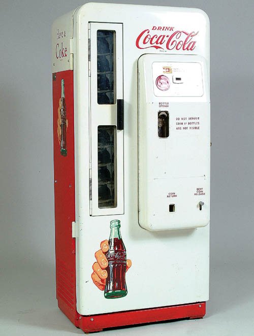 A GOOD "CAVALIER" COKE MACHINE circa 19: A GOOD "CAVALIER" COKE MACHINE circa 1960, with glass door for dispensing bottles, Model CS-72-A. Fine original condition. Height 57". Estimate $600-$900