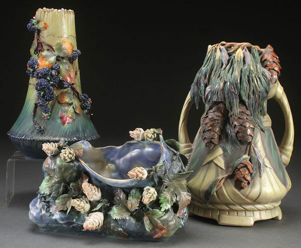 THREE AUSTRIAN AMPHORA RETICULATED AND APPLIED PO: THREE AUSTRIAN AMPHORA RETICULATED AND APPLIED PORCELAIN VASES, CIRCA 1900. Comprising a large two handled pinecone vase, a mulberry planter, and blackberry vase, the latter two with some loss. The la