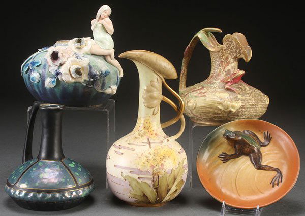 A FOUR PIECE GROUP OF AUSTRIAN ART POTTERY, 19TH/: A FOUR PIECE GROUP OF AUSTRIAN ART POTTERY, 19TH/20TH CENTURY. Comprising an RSTK hand-painted floral vase with leaf form handle, and Amphora figural and applied floral vase, a Stellmacher ewer, and a