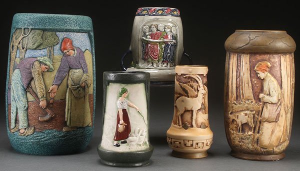 FOUR AUSTRIAN AMPHORA EMBOSSED SCENIC VASES, EARL: FOUR AUSTRIAN AMPHORA EMBOSSED SCENIC VASES, EARLY 20TH CENTURY. Including three large "Brittany Farmers" vases after a design by Elvir Otto, and a scenic mountain goat vase, together with an Austrian