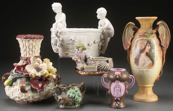 SIX PIECE GROUP AUSTRIAN ART POTTERY, CIRCA 1900: SIX PIECE GROUP AUSTRIAN ART POTTERY, CIRCA 1900 Including a large Amphora basket weave embossed vase with applied florals, an Imperial Amphora putti handled basket with applied florals, a figural Imp