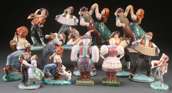 ELEVEN PIECE GROUP OF CZECH ART POTTERY FIGURES,: ELEVEN PIECE GROUP OF CZECH ART POTTERY FIGURES, 20TH CENTURY. Sculpted as various dancers and musicians together with a similar Bavarian dancing couple and Japanese figure of a boy with dog. The larg