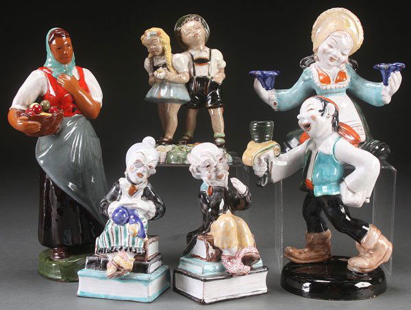SIX AUSTRIAN ART POTTERY FIGURES, 20TH CENTURY Co: SIX AUSTRIAN ART POTTERY FIGURES, 20TH CENTURY Comprising four Anzengruber, an unmarked Redware figure of a Bavarian couple, and Redware figure of a woman with fruit basket impressed with R monogram a