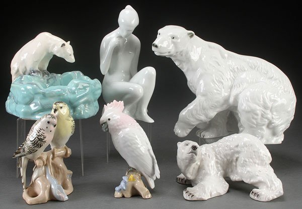FIVE ROYAL DUX PORCELAIN FIGURES, 20TH CENTURY: FIVE ROYAL DUX PORCELAIN FIGURES, 20TH CENTURY. Comprising a large polar bear, a smaller polar bear, a seated nude, and two bird figures, together with a Czech polar bear figural planter. The largest 