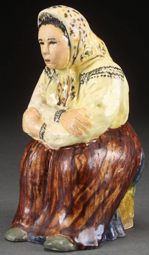 A JANE CALLANDER CALIFORNIA ART POTTERY FIGURE: A JANE CALLANDER CALIFORNIA ART POTTERY FIGURE OF A SEATED BABUSHKA, MID 20TH CENTURY. Signed on interior "JANE CALLANDER." Height 6.75 inches (17 cm).